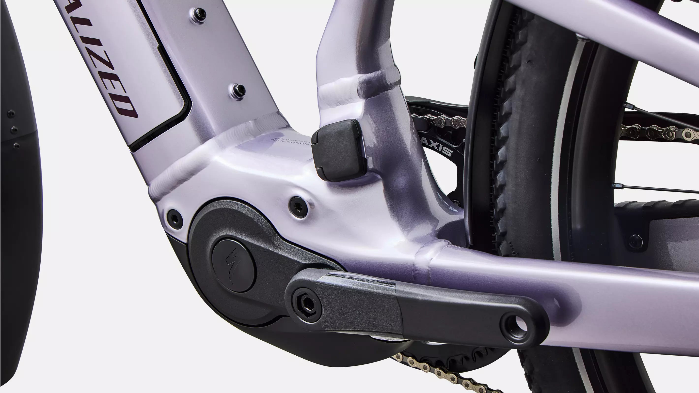 Close-up of a bicycle pedal and chain mechanism with a blurred background