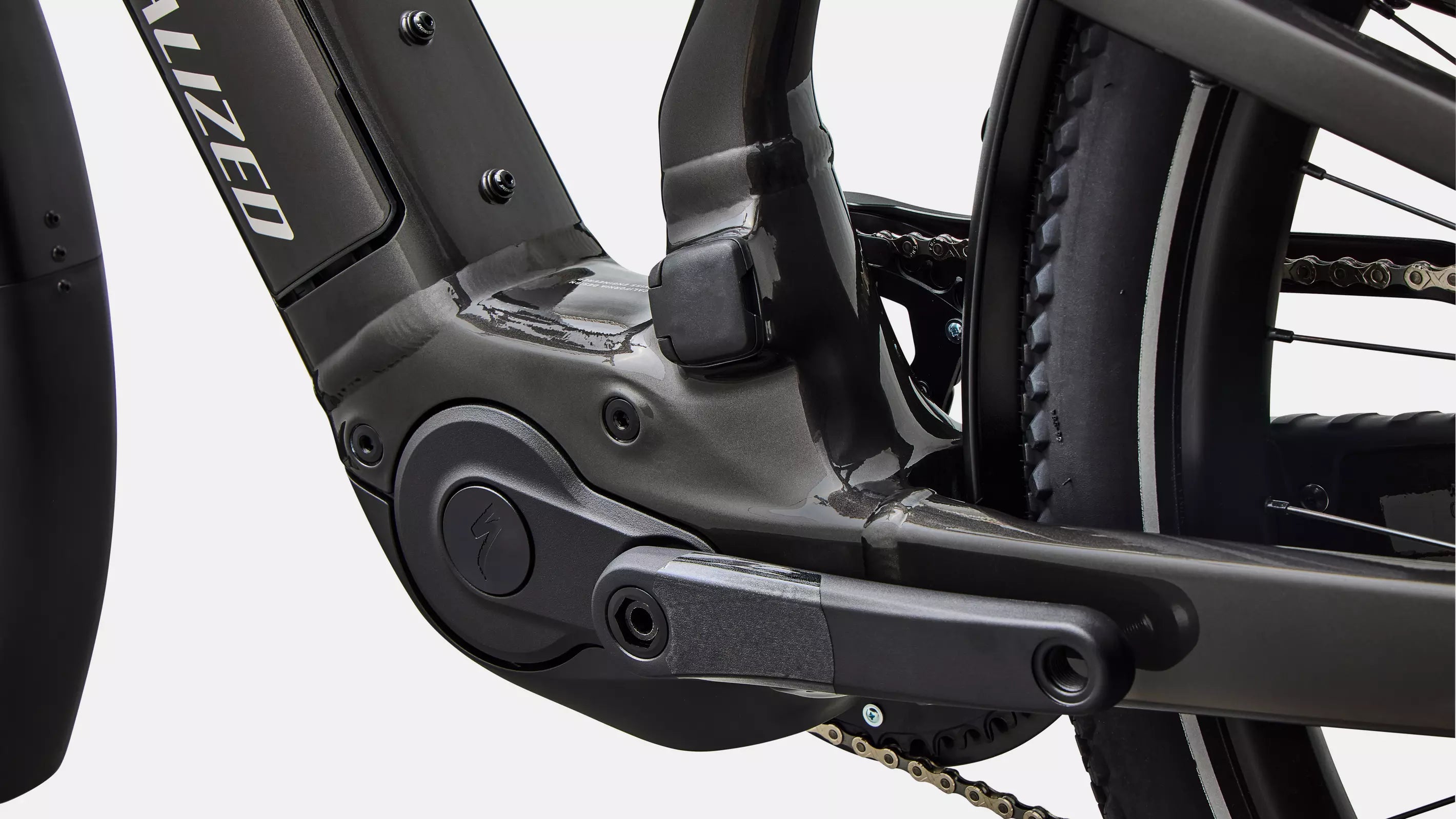 Close-up of a bicycle chain mechanism with 'Specialized' branding.